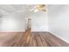 Spacious living room featuring wood floors, a ceiling fan, and plenty of natural light at 6304 Timberline Dr. # B, Myrtle Beach, SC 29572