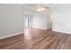 Bright living room boasting vaulted ceilings, hardwood floors, and access to the backyard at 6304 Timberline Dr. # B, Myrtle Beach, SC 29572