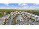 Aerial view of condo community featuring well manicured grounds, parking, a bridge, and waterway at 633 Waterway Village Blvd # 11D, Myrtle Beach, SC 29579