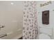 Bathroom featuring a tub-shower combination with a charming sea shell patterned shower curtain at 633 Waterway Village Blvd # 11D, Myrtle Beach, SC 29579