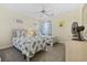 Inviting bedroom featuring twin beds, ceiling fan, and bright decor to create a cozy space at 633 Waterway Village Blvd # 11D, Myrtle Beach, SC 29579