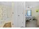 The bedroom features twin beds with pineapple-themed covers and there is an attached bathroom with shower and tub at 633 Waterway Village Blvd # 11D, Myrtle Beach, SC 29579