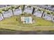 Aerial view of community swimming pool, hot tub, and ample seating surrounded by lush landscaping at 633 Waterway Village Blvd # 11D, Myrtle Beach, SC 29579
