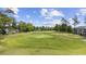View of the well-maintained community golf course with manicured green grass and trees at 633 Waterway Village Blvd # 11D, Myrtle Beach, SC 29579