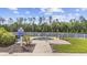 Outdoor community hot tub on concrete pad with surrounding green space and fencing at 633 Waterway Village Blvd # 11D, Myrtle Beach, SC 29579