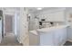 Bright kitchen with white cabinets, modern appliances, and a breakfast bar at 633 Waterway Village Blvd # 11D, Myrtle Beach, SC 29579
