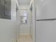 Compact laundry area featuring a window, a washer, and a dryer at 633 Waterway Village Blvd # 11D, Myrtle Beach, SC 29579