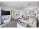 Bright, open-concept living room featuring comfortable seating, modern tv, and seamless flow to the dining area at 633 Waterway Village Blvd # 11D, Myrtle Beach, SC 29579