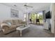 Comfortable living room with a ceiling fan, and sliding glass doors at 633 Waterway Village Blvd # 11D, Myrtle Beach, SC 29579