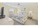 Comfortable main bedroom with natural light, complete with ceiling fan and tropical-themed decor at 633 Waterway Village Blvd # 11D, Myrtle Beach, SC 29579