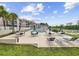 Community pool with tables, lounge chairs, umbrellas, and condo buildings in the background at 633 Waterway Village Blvd # 11D, Myrtle Beach, SC 29579