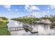Scenic waterfront view featuring a long pier with a covered gazebo and beautiful waterfront homes at 633 Waterway Village Blvd # 11D, Myrtle Beach, SC 29579