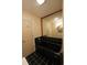 Bathroom with black tile, black tub, and a large mirror at 669 George Washington Trail, Georgetown, SC 29440