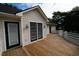 Spacious outdoor deck perfect for entertaining, featuring elegant lighting and multiple access points at 669 George Washington Trail, Georgetown, SC 29440