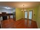 Cozy eat-in kitchen with modern appliances, wood cabinets, and an adjacent dining area at 669 George Washington Trail, Georgetown, SC 29440
