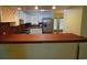 This kitchen features butcher block counters, stainless appliances, white cabinets, and a wine rack at 669 George Washington Trail, Georgetown, SC 29440