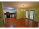 Open layout with wood floors, white cabinets, stainless steel appliances, and lime green walls at 669 George Washington Trail, Georgetown, SC 29440