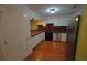 An open kitchen with wood floors, butcher block counters, stainless steel appliances, and white cabinets at 669 George Washington Trail, Georgetown, SC 29440