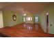 Open living room with hardwood floors, shutters, and neutral colors, creating a welcoming space at 669 George Washington Trail, Georgetown, SC 29440