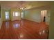 Spacious open living room with hardwood floors, shutters, and natural light at 669 George Washington Trail, Georgetown, SC 29440