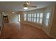 Bright sunroom with tile flooring, plantation shutters, and sliding glass door at 669 George Washington Trail, Georgetown, SC 29440
