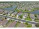 Stunning aerial shot of a home in a tranquil neighborhood near a lake, showcasing the surrounding community at 691 Sandberg St., Surfside Beach, SC 29575
