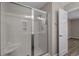 Updated bathroom with white shower and glass doors at 691 Sandberg St., Surfside Beach, SC 29575