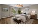 Serene bedroom with a comfortable bed, wood floors, and views from the window at 691 Sandberg St., Surfside Beach, SC 29575
