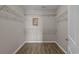 Walk-in closet with wire shelving and wood-look flooring at 691 Sandberg St., Surfside Beach, SC 29575