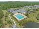 Aerial view of the community pool area with a large swimming pool, lounge chairs, and well-maintained landscaping at 691 Sandberg St., Surfside Beach, SC 29575