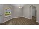 Neutral dining area with light walls, a chandelier, and a window offering natural light at 691 Sandberg St., Surfside Beach, SC 29575