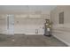 Garage with water heater, painted walls and door to exterior at 691 Sandberg St., Surfside Beach, SC 29575