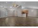 Open living space with hardwood floors, vaulted ceiling, and seamless flow to kitchen at 691 Sandberg St., Surfside Beach, SC 29575