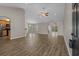 Spacious open-concept living area with hardwood floors, neutral walls, and arched doorways at 691 Sandberg St., Surfside Beach, SC 29575