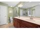 Bathroom featuring double sink vanity with a large mirror and ample lighting at 696 Rambler Ct., Myrtle Beach, SC 29588