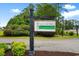 Sugar Mill Plantation community sign surrounded by greenery and beautiful landscaping at 696 Rambler Ct., Myrtle Beach, SC 29588