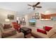 Bright living room with fan and cozy seating area with flat screen tv at 696 Rambler Ct., Myrtle Beach, SC 29588