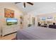 Spacious main bedroom featuring natural light, ceiling fan, and tv at 696 Rambler Ct., Myrtle Beach, SC 29588
