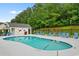 Community pool with various chairs, safety equipment and surrounded by trees for privacy at 696 Rambler Ct., Myrtle Beach, SC 29588