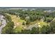 A stunning aerial view of a golf course community with lush greenery and serene water features at 760 Charter Dr. # D-4, Longs, SC 29568