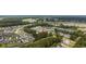 An elevated shot reveals homes near a golf course, surrounded by natural beauty and mature trees at 760 Charter Dr. # D-4, Longs, SC 29568
