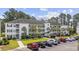Well-maintained three-story condominium with beautifully landscaped grounds and ample parking spaces available for residents and visitors at 760 Charter Dr. # D-4, Longs, SC 29568