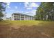 Condo building with multiple screened porches and lush green space at 760 Charter Dr. # D-4, Longs, SC 29568