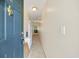 Inviting hallway with neutral tones leading to a bright living space with a door knocker and a view of the living area at 760 Charter Dr. # D-4, Longs, SC 29568