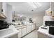 Practical kitchen with white appliances, plenty of counter space, and an open view to the living area, perfect for cooking and socializing at 760 Charter Dr. # D-4, Longs, SC 29568