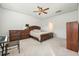 Comfortable bedroom featuring a bed, dresser, and ample space with light carpet and ceiling fan at 787 Dusty Pine Way, Myrtle Beach, SC 29588