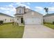 Charming two-story home with a well-maintained lawn and a two-car garage in a suburban neighborhood at 787 Dusty Pine Way, Myrtle Beach, SC 29588