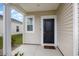 A welcoming front entrance featuring a black door and charming exterior finishes at 787 Dusty Pine Way, Myrtle Beach, SC 29588