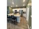Bright kitchen featuring a large island, granite countertops, and stainless steel appliances at 787 Dusty Pine Way, Myrtle Beach, SC 29588