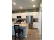 Modern kitchen featuring stainless steel appliances, granite countertops, and ample storage space at 787 Dusty Pine Way, Myrtle Beach, SC 29588